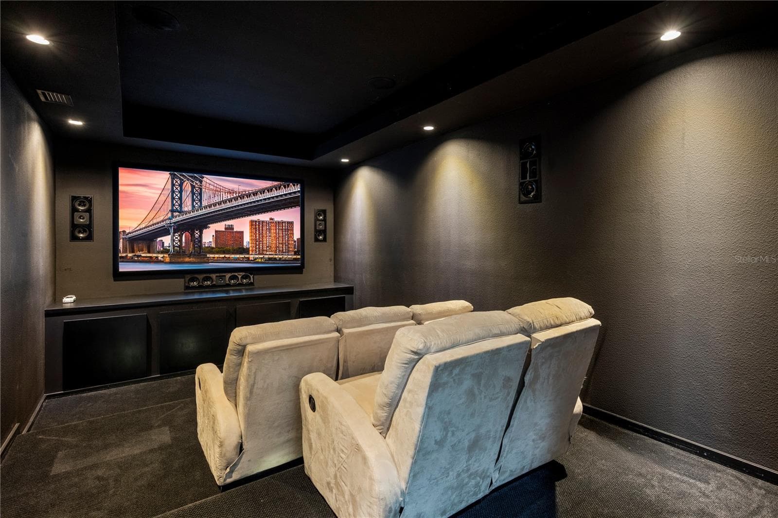 The updated home theater with tiered seating