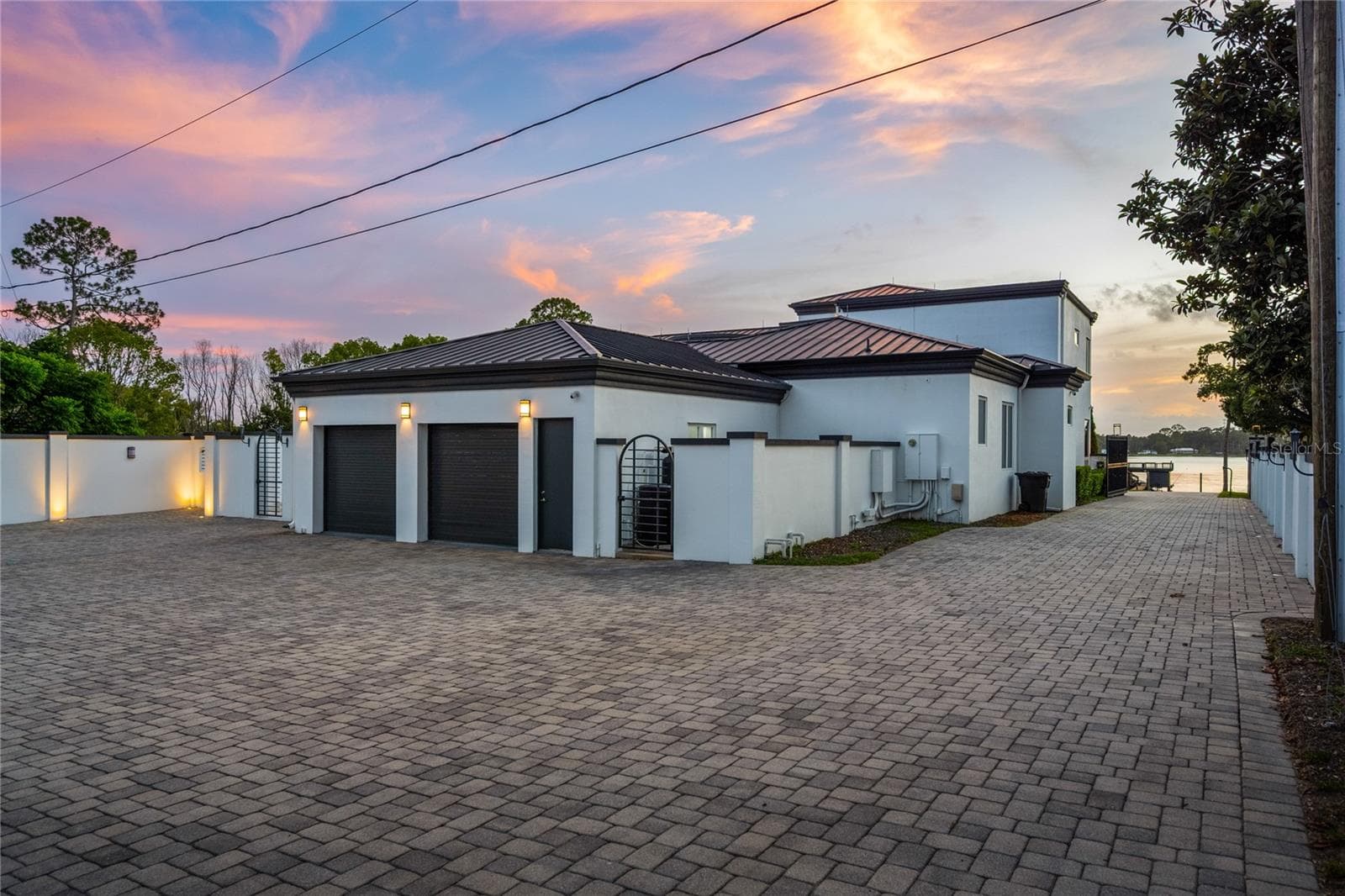 The detached climate-controlled showroom garage with its built-in vehicle lift