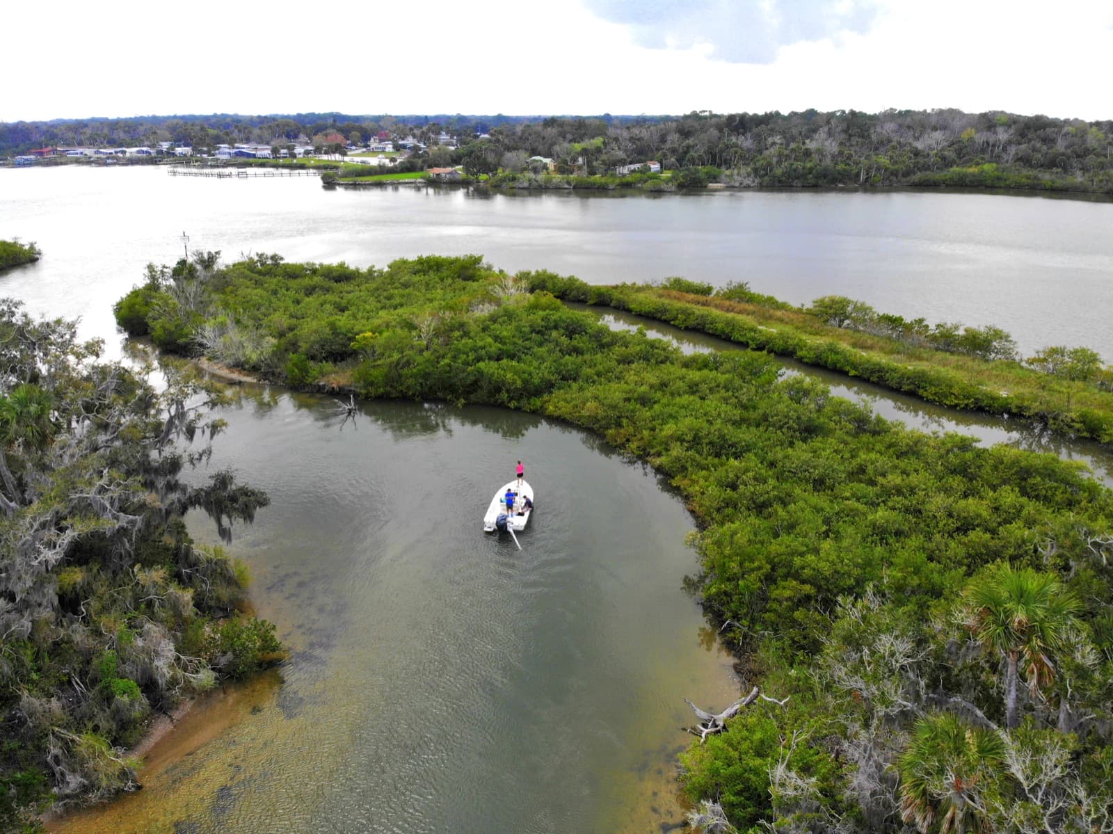 Aerial view of a boat navigating the Indian River waterway near Oak Hill, Florida