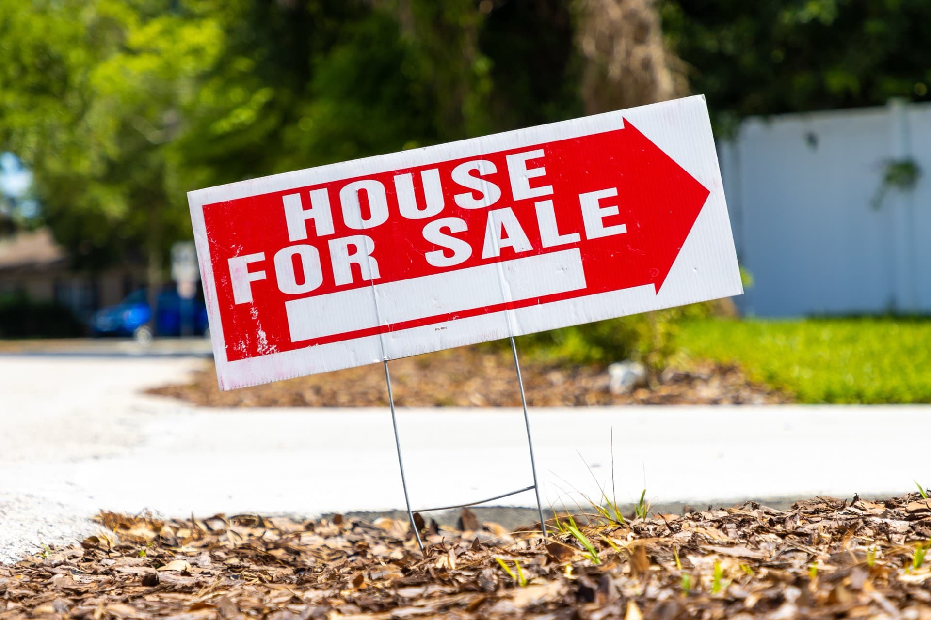 Florida home with for sale sign in front yard