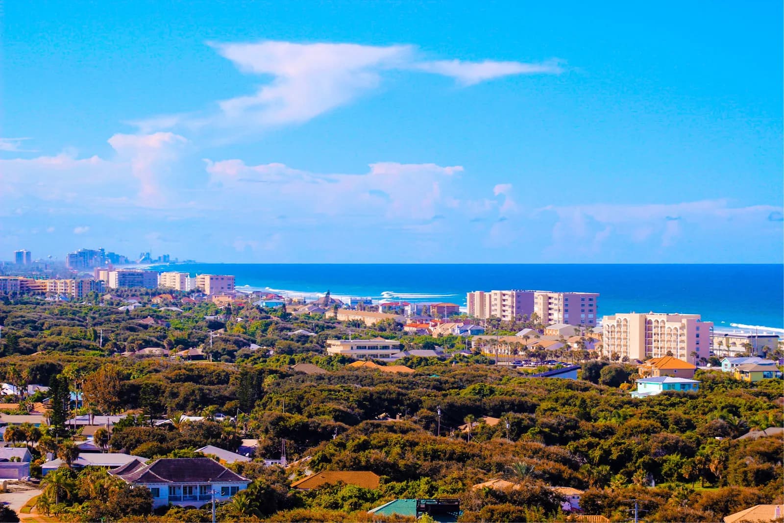 Aerial view of the Volusia Coast showing Port Orange neighborhoods, coastal condominiums, and the Atlantic Ocean