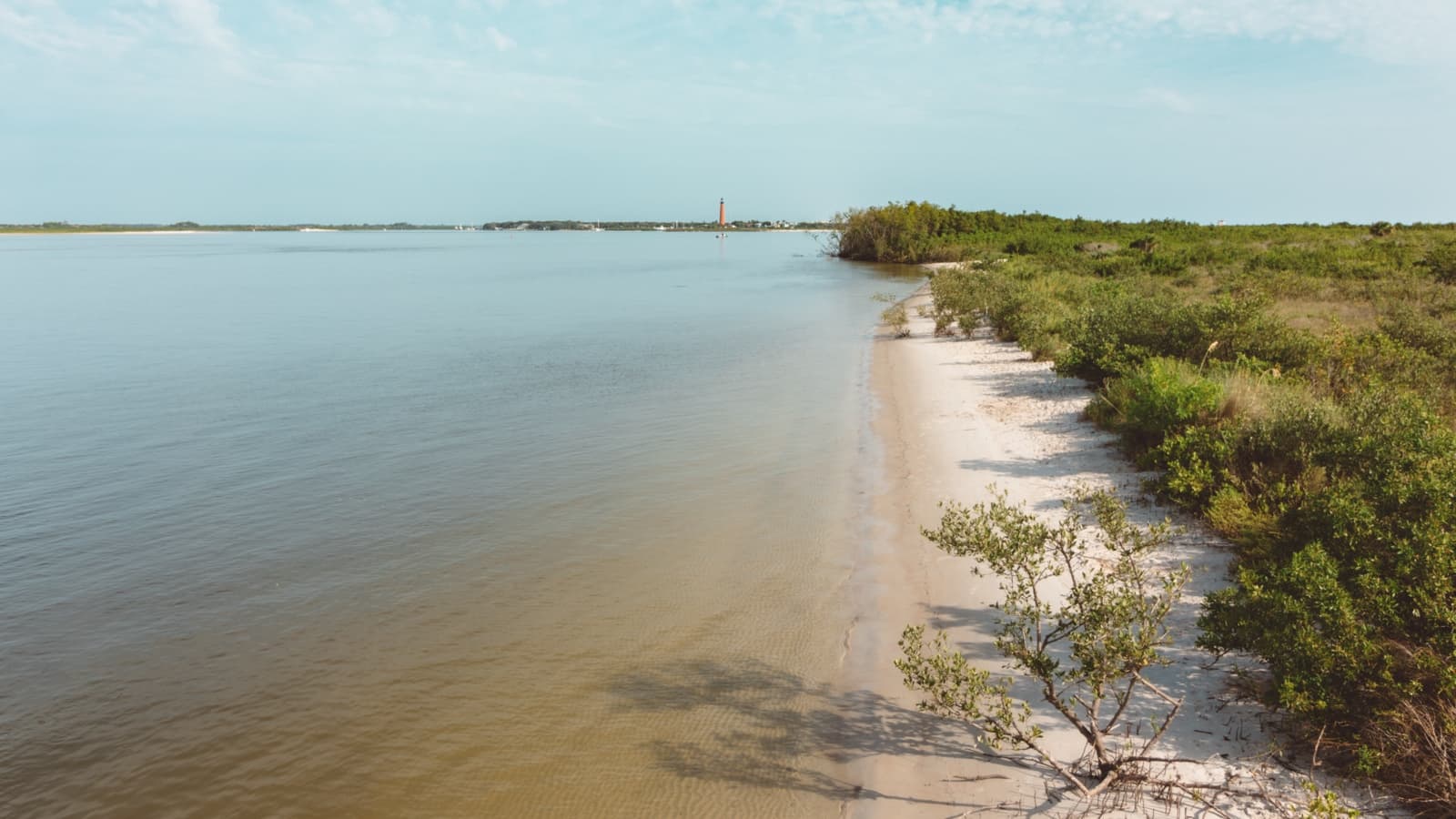 View of the Indian River Lagoon from Smyrna Dunes Park with calm waters reflecting the sky