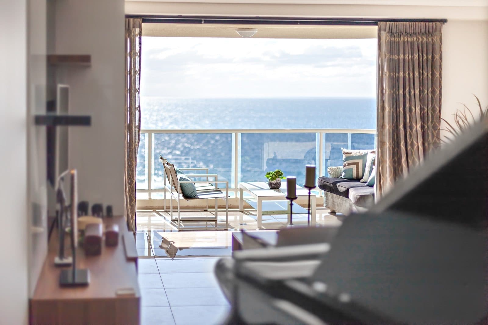 Luxury condo interior with balcony overlooking the Atlantic Ocean