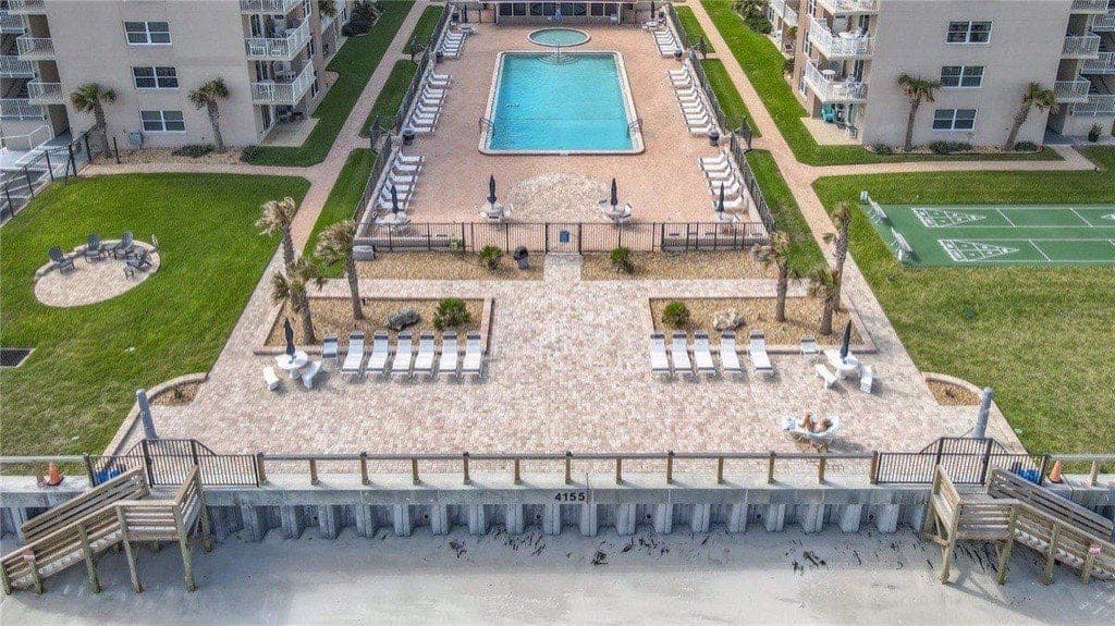 Sea Coast Gardens pool deck, shuffleboard court, and beach access boardwalk overlooking the Atlantic