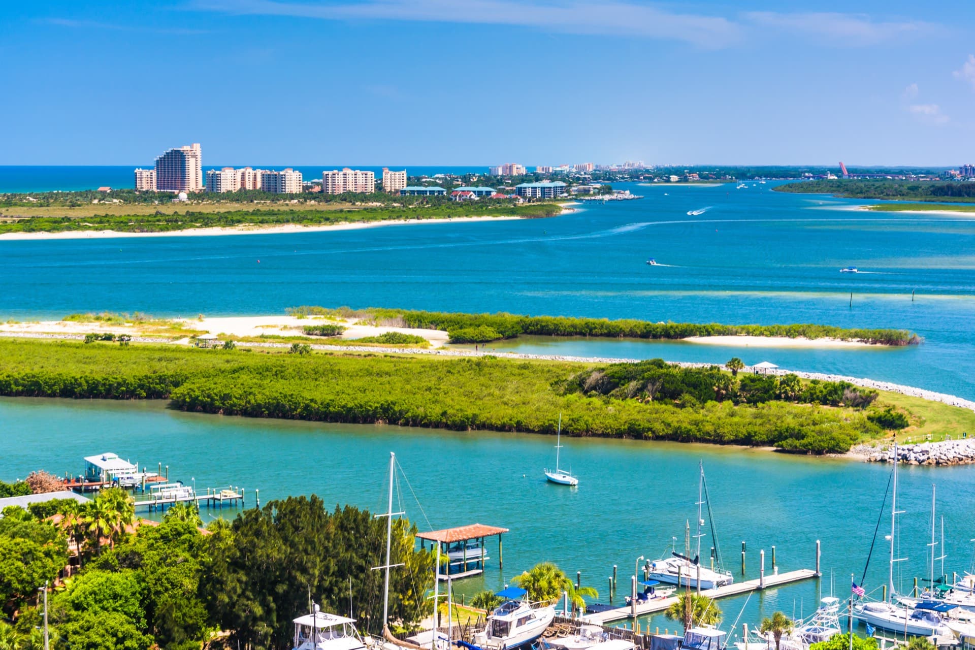 Aerial view of New Smyrna Beach coastal real estate market