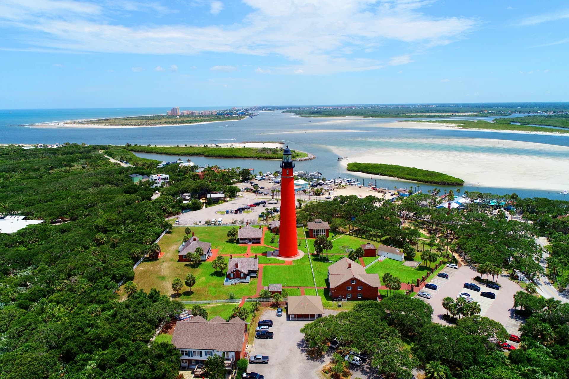 The Ponce de Leon Inlet Lighthouse from the air, with the inlet and barrier island beyond