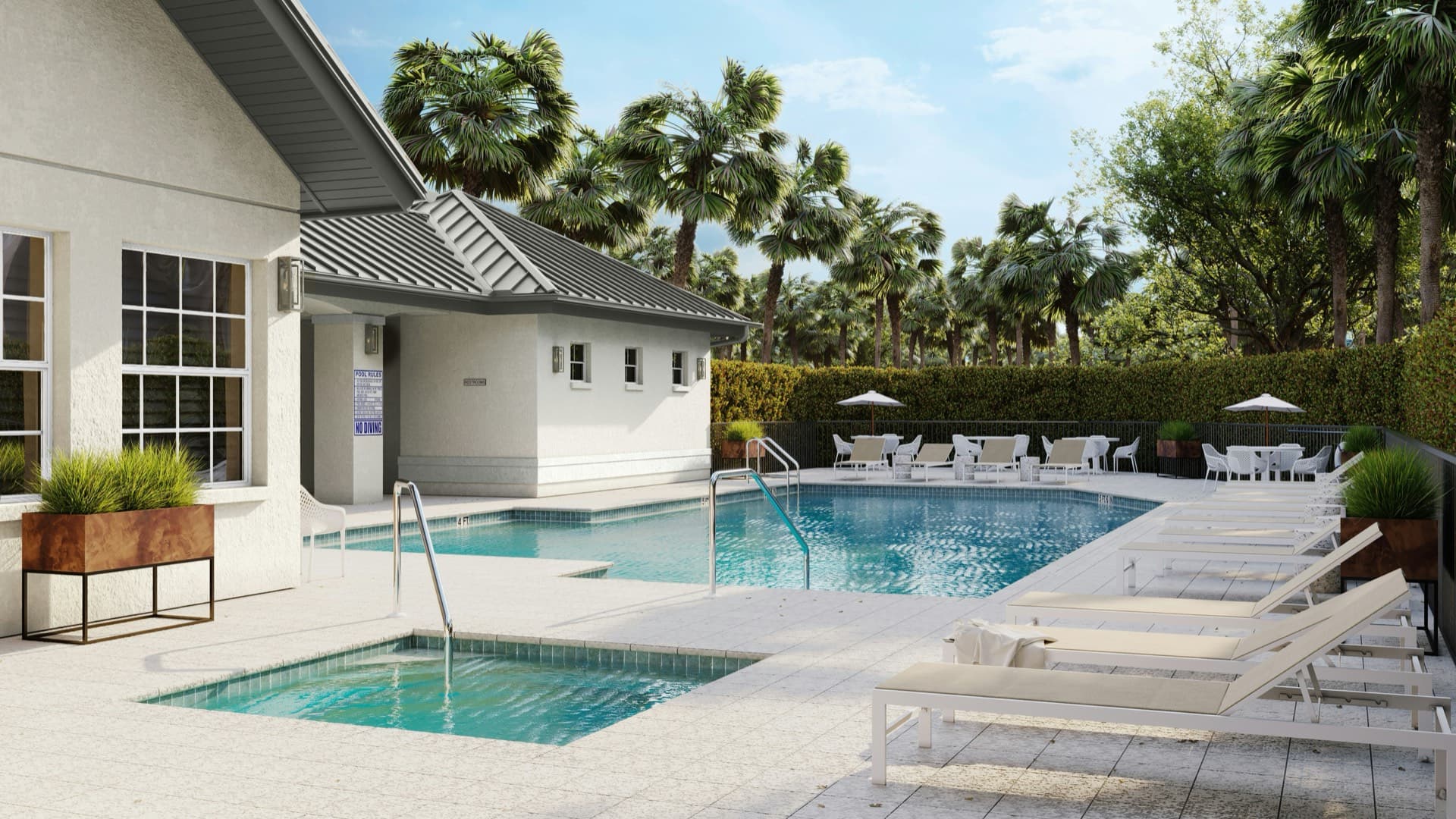 Resort-style pool and spa surrounded by palm trees at a New Smyrna Beach vacation rental property