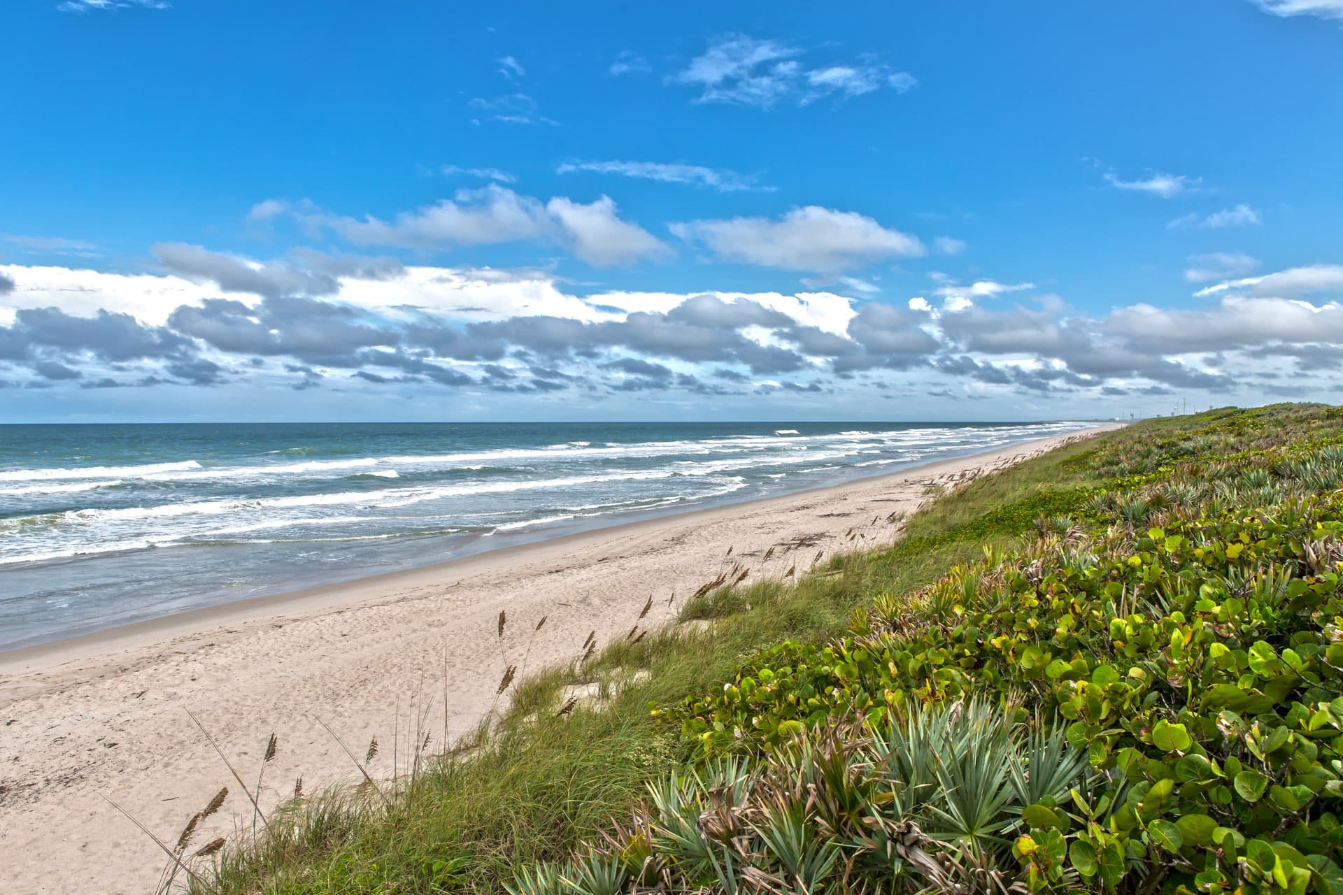 Oceanfront condominiums and beach access along Beachside South in New Smyrna Beach