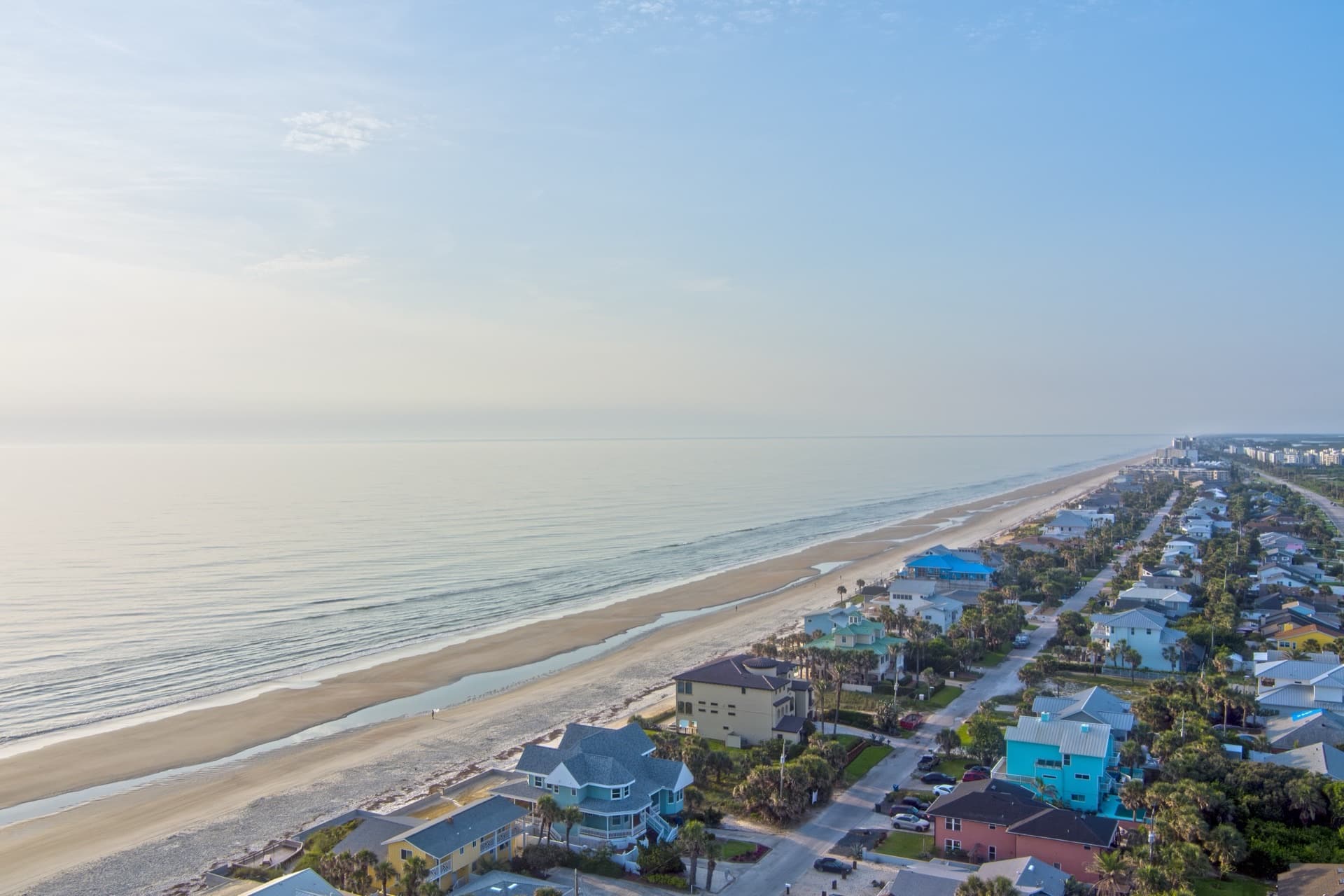 Aerial view of New Smyrna Beach waterfront homes and neighborhoods