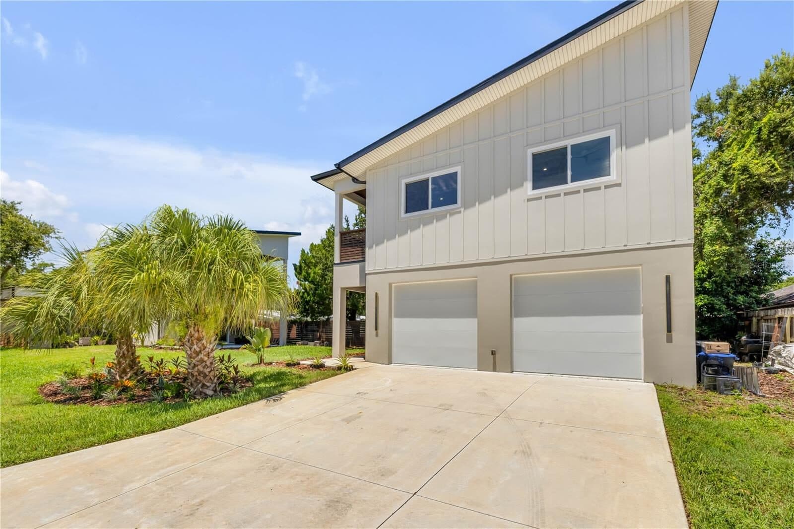 The detached two-car garage and the second driveway that serves it